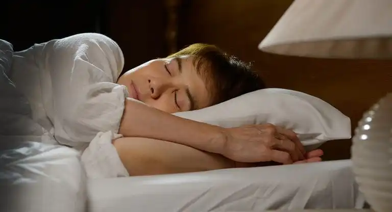 Person sleeping peacefully on pillow