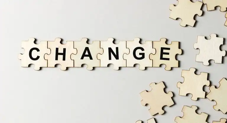 Puzzle pieces spelling CHANGE