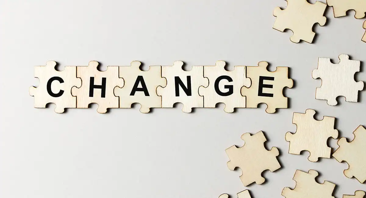 Puzzle pieces spelling CHANGE