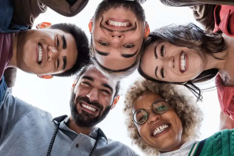 Diverse group smiling together