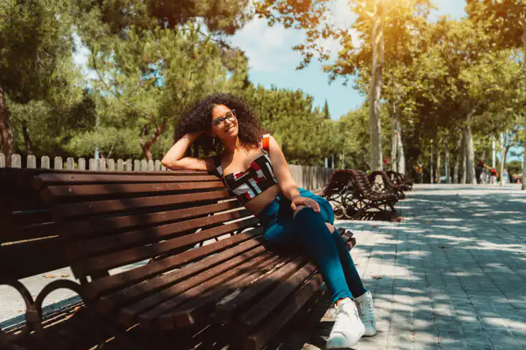 Woman relaxing on park bench