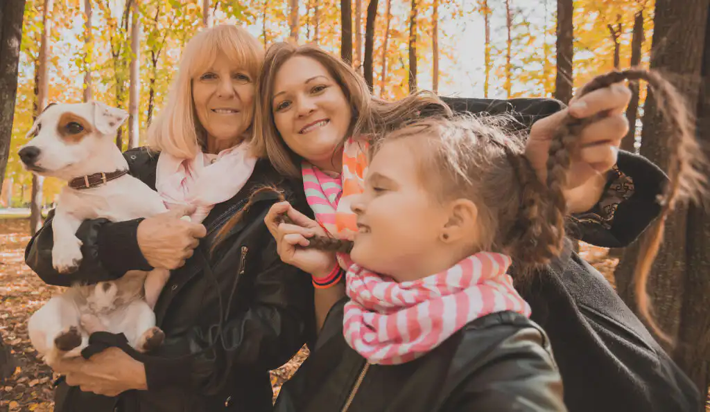 Family with dog in autumn